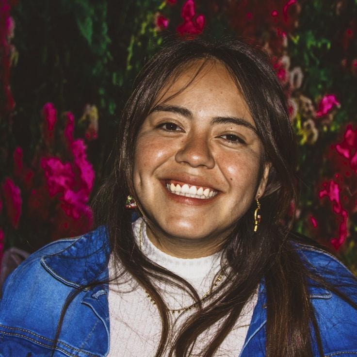 Kaveri Mehta, Lead Design Curator at SoftCornerRoute, reviewing corporate floral arrangements